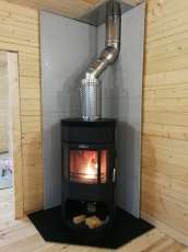 Недорогой камин с отделкой шамотом Сибирь 12 фото в интерьере в Лиде