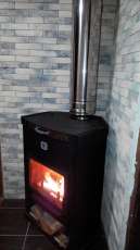 Стальной недорогой камин Теплодар ОВ-120 (угловой) фото в интерьере в Лиде