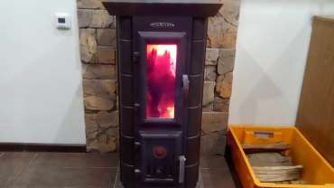 Стальная печь Термофор Статика Тетра, чёрная бронза фото в интерьере в Лиде