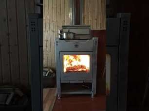 Стальной камин со стеклом Теплодар Кадриль фото в интерьере в Лиде