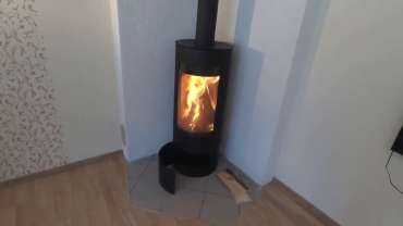 Стильная печь-камин с шамотом Мета-Бел Селигер в Лиде фото в интерьере в Лиде