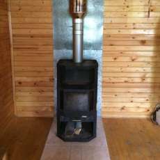 Печь-камин с шамотом Мета-Бел Ангара-Аква в интерьере фото в Лиде