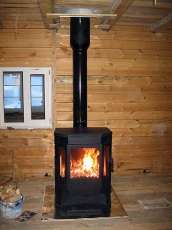 Печь-камин Бавария водяной с плитой в интерьере в Лиде