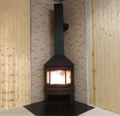 Стальной камин Бавария Мюнхен угловой чёрный (без перемычки) фото в интерьере в Лиде