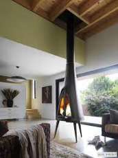 Печь-камин чугунный Invicta Pow-Wow в интерьере Амазонка бай фото в Лиде