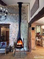 Печь-камин чугунный Invicta Pow-Wow в интерьере Амазонка бай фото в Лиде