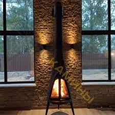 Печь-камин чугунный Invicta Pow-Wow в интерьере Амазонка бай фото в Лиде